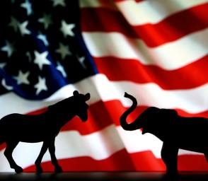 donkey and elephant silhouette in front of an american flag