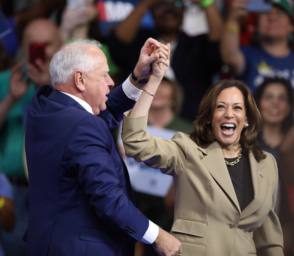 Kamala Harris and Tim Walz celebrating